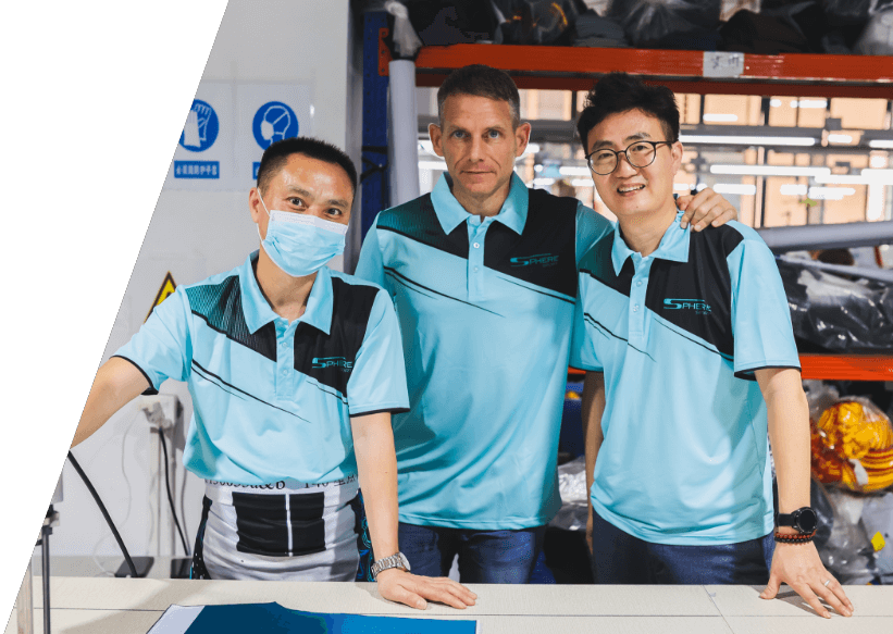 Sam Clay and Eric Fan with employee in Sphere Sport China factory