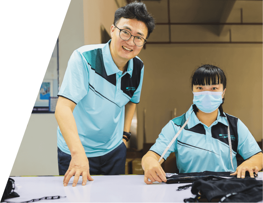 Sphere Sport production director eric fan with quality control employee